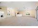 Bright and spacious living room with high ceilings and light-colored flooring at 6234 Sturbridge Ct, Sarasota, FL 34238