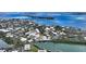 Aerial view of waterfront home with surrounding neighborhood at 625 Jackson Way, Longboat Key, FL 34228