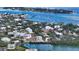 Aerial view of a house on the waterfront, near other homes at 625 Jackson Way, Longboat Key, FL 34228