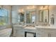 Double vanity bathroom with soaking tub and walk in shower at 625 Jackson Way, Longboat Key, FL 34228