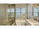 Spa-like bathroom with soaking tub, walk-in shower, and double vanity at 625 Jackson Way, Longboat Key, FL 34228