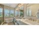 Elegant bathroom with double vanity and soaking tub at 625 Jackson Way, Longboat Key, FL 34228