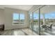 Bedroom with sliding glass doors leading to a balcony at 625 Jackson Way, Longboat Key, FL 34228