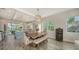 Kitchen dining area with wooden table and bench seating at 625 Jackson Way, Longboat Key, FL 34228