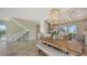 Bright dining area with farmhouse table and bench seating at 625 Jackson Way, Longboat Key, FL 34228