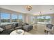 Waterfront Gathering room featuring comfortable seating and large windows at 625 Jackson Way, Longboat Key, FL 34228