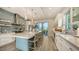 Modern kitchen with large island and light-colored cabinetry at 625 Jackson Way, Longboat Key, FL 34228