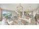 Open living area with hardwood floors and large windows at 625 Jackson Way, Longboat Key, FL 34228