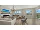 Bright living room with hardwood floors and water views at 625 Jackson Way, Longboat Key, FL 34228