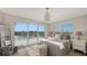 Bedroom with private balcony, water views, and stylish decor at 625 Jackson Way, Longboat Key, FL 34228