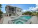 Home features a refreshing pool and spa, perfect for relaxation and entertaining at 625 Jackson Way, Longboat Key, FL 34228