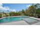 Relaxing pool and spa area with surrounding landscaping at 625 Jackson Way, Longboat Key, FL 34228