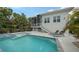 Spacious pool area with spa, patio, and screened porch at 625 Jackson Way, Longboat Key, FL 34228