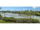 Scenic waterfront view with lush greenery and boat docks at 625 Jackson Way, Longboat Key, FL 34228