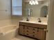 Bathroom with double vanity and soaking tub at 6329 Robin Cv, Lakewood Ranch, FL 34202