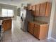 Kitchen with stainless steel appliances and wood cabinets at 6329 Robin Cv, Lakewood Ranch, FL 34202