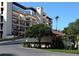 Building exterior showcasing a multi-story building with balconies and landscaping at 6440 Mourning Dove Dr # 101, Bradenton, FL 34210