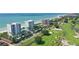 Aerial view of luxurious beachfront condos near golf course at 675 Longboat Club Rd # 22A, Longboat Key, FL 34228