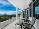 Relaxing balcony overlooking ocean views with patio furniture at 675 Longboat Club Rd # 22A, Longboat Key, FL 34228