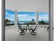 Spacious balcony with ocean views and outdoor furniture at 675 Longboat Club Rd # 22A, Longboat Key, FL 34228