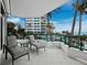 Spacious balcony with seating and partial ocean view at 675 Longboat Club Rd # 22A, Longboat Key, FL 34228