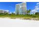 White sand beach and oceanfront building at 675 Longboat Club Rd # 22A, Longboat Key, FL 34228