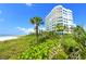 Oceanfront building with tropical landscaping at 675 Longboat Club Rd # 22A, Longboat Key, FL 34228