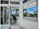 Bedroom with sliding doors to balcony and golf course views at 675 Longboat Club Rd # 22A, Longboat Key, FL 34228