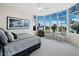 Spacious bedroom with large windows, water views and sitting area at 675 Longboat Club Rd # 22A, Longboat Key, FL 34228