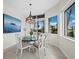 Elegant dining room with glass-top table and ocean views at 675 Longboat Club Rd # 22A, Longboat Key, FL 34228