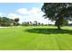 Expansive green golf course fairways under a sunny sky at 675 Longboat Club Rd # 22A, Longboat Key, FL 34228