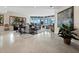 Spacious living room with ocean views and tile floors at 675 Longboat Club Rd # 22A, Longboat Key, FL 34228