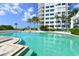 Inviting pool area with surrounding building at 675 Longboat Club Rd # 22A, Longboat Key, FL 34228