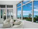 Comfortable sitting area with two armchairs and stunning ocean views at 675 Longboat Club Rd # 22A, Longboat Key, FL 34228