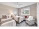 Bedroom with twin beds, zebra chair, and gray patterned wallpaper at 7117 River Club Blvd, Bradenton, FL 34202