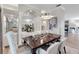 Elegant dining room features a dark wood table, and chic seating at 7117 River Club Blvd, Bradenton, FL 34202