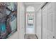 Hallway with large art piece and access to other rooms at 7117 River Club Blvd, Bradenton, FL 34202