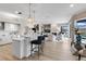 Open concept kitchen with island, stainless steel appliances, and white cabinetry at 7117 River Club Blvd, Bradenton, FL 34202