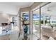 Bright living room with glass doors opening to pool and patio area at 7117 River Club Blvd, Bradenton, FL 34202