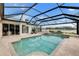 Stunning pool with a covered patio and beautiful lake views at 7117 River Club Blvd, Bradenton, FL 34202