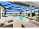 Resort-style pool and patio with covered seating area and lake view at 7117 River Club Blvd, Bradenton, FL 34202