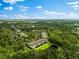 Aerial view of community with lush green landscape and serene lake at 7417 Vista Way # 106, Bradenton, FL 34202