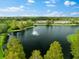 Community lakefront view with fountain and lush greenery at 7417 Vista Way # 106, Bradenton, FL 34202