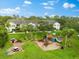 Community playground with picnic tables and green space at 7417 Vista Way # 106, Bradenton, FL 34202