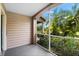 Screened-in porch with view of the exterior and tropical landscaping at 7417 Vista Way # 106, Bradenton, FL 34202