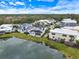 Community view with lakefront home at 7716 Club Ln, Sarasota, FL 34238