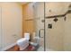 Bathroom with walk-in shower, toilet and hardwood floors at 7716 Club Ln, Sarasota, FL 34238