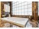 Relaxing bathroom with a large soaking tub and marble accents at 7716 Club Ln, Sarasota, FL 34238