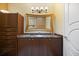 Bathroom with marble vanity, large mirror, and shower at 7716 Club Ln, Sarasota, FL 34238