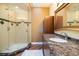 Bathroom with walk-in shower, marble vanity and skylight at 7716 Club Ln, Sarasota, FL 34238